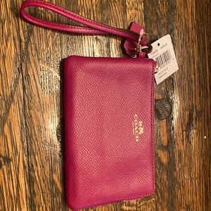 Coach corner zip leather wristlet.